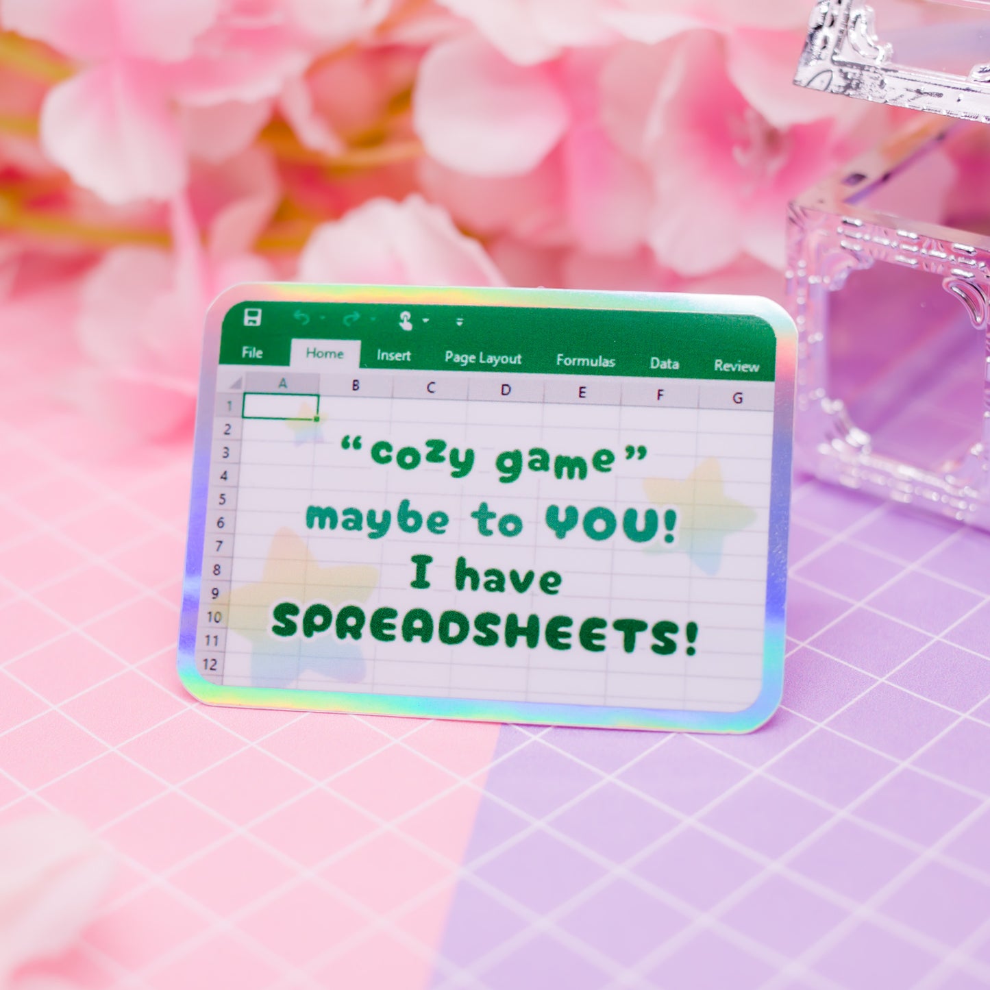 "Cozy game! Maybe to YOU! I have SPREADSHEETS!" holographic vinyl sticker